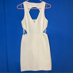 Modern white body con dress with sexy cutouts